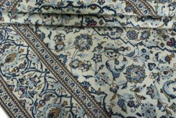 Close-up detail of 2000s Kashan rug from Iran / Persia showing Wool weave
