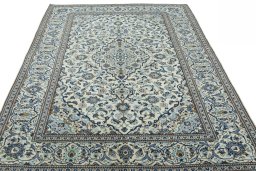 Surface texture of 2000s Kashan rug with natural Wool and intricate pattern