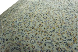 Backside of handmade 2000s Kashan rug showing knot structure and weave density