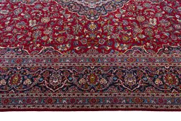 Corner detail of 1970s Kashan rug showing border pattern and Wool pile