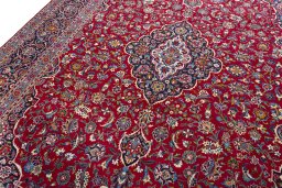 Backside of handmade 1970s Kashan rug showing knot structure and weave density