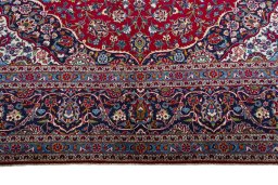 Full view of 1970s Kashan rug from Iran / Persia, 428 × 294 cm in Red tones