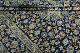 Close-up detail of 2000s Kashan rug from Iran / Persia showing Wool weave