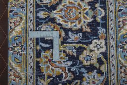 Backside of handmade 2000s Kashan rug showing knot structure and weave density