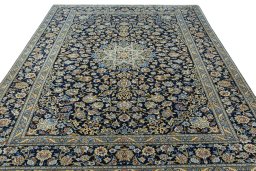 Surface texture of 2000s Kashan rug with natural Wool and intricate pattern