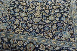 Close-up detail of 2000s Kashan rug from Iran / Persia showing Wool weave