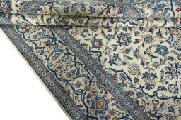 Close-up detail of 2000s Kashan rug from Iran / Persia showing Wool weave