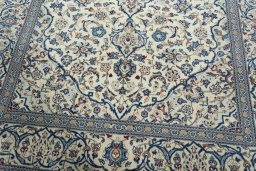 Close-up detail of 2000s Kashan rug from Iran / Persia showing Wool weave