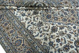 Close-up detail of 2000s Kashan rug from Iran / Persia showing Wool weave