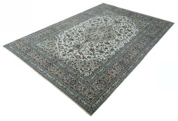 Corner detail of 2000s Kashan rug showing border pattern and Wool pile
