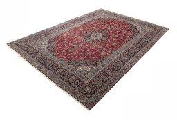Corner detail of 2000s Kashan rug showing border pattern and Wool pile