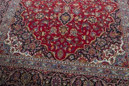 Close-up detail of 2000s Kashan rug from Iran / Persia showing Wool weave
