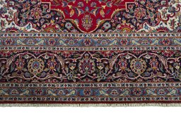 Full view of 2000s Kashan rug from Iran / Persia, 356 × 250 cm in Red tones