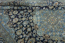 Close-up detail of 2000s Kashan rug from Iran / Persia showing Wool weave