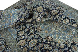 Surface texture of 2000s Kashan rug with natural Wool and intricate pattern