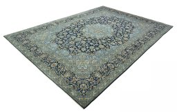 Corner detail of 2000s Kashan rug showing border pattern and Wool pile