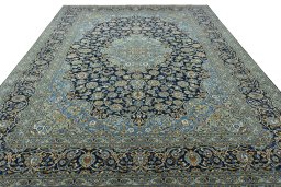 Surface texture of 2000s Kashan rug with natural Wool and intricate pattern