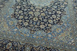 Close-up detail of 2000s Kashan rug from Iran / Persia showing Wool weave