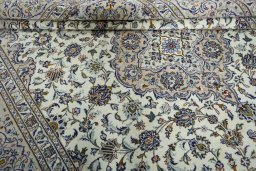 Close-up detail of 2000s Kashan rug from Iran / Persia showing Wool weave