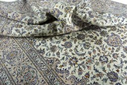 Surface texture of 2000s Kashan rug with natural Wool and intricate pattern