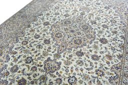 Backside of handmade 2000s Kashan rug showing knot structure and weave density