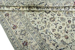 Close-up detail of 2000s Kashan rug from Iran / Persia showing Wool weave