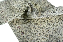 Surface texture of 2000s Kashan rug with natural Wool and intricate pattern