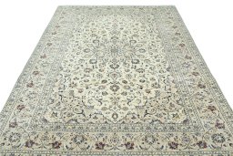 Surface texture of 2000s Kashan rug with natural Wool and intricate pattern