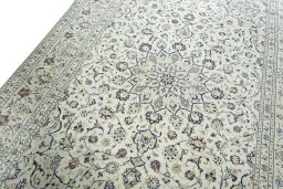 Backside of handmade 2000s Kashan rug showing knot structure and weave density