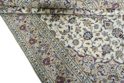 Close-up detail of 2000s Kashan rug from Iran / Persia showing Wool weave