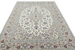 Surface texture of 2000s Kashan rug with natural Wool and intricate pattern
