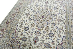 Backside of handmade 2000s Kashan rug showing knot structure and weave density