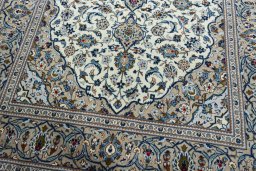 Close-up detail of 2000s Kashan rug from Iran / Persia showing Wool weave