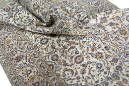 Surface texture of 2000s Kashan rug with natural Cork and intricate pattern