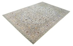Corner detail of 2000s Kashan rug showing border pattern and Cork pile