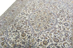 Backside of handmade 2000s Kashan rug showing knot structure and weave density
