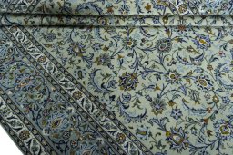 Close-up detail of 2000s Kashan rug from Iran / Persia showing Wool weave