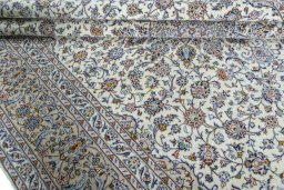 Close-up detail of 2000s Kashan rug from Iran / Persia showing Wool weave