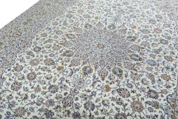 Backside of handmade 2000s Kashan rug showing knot structure and weave density