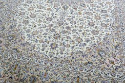 Close-up detail of 2000s Kashan rug from Iran / Persia showing Wool weave