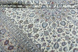 Close-up detail of 2000s Kashan rug from Iran / Persia showing Wool weave