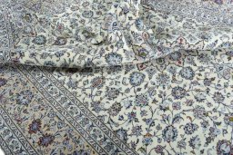 Surface texture of 2000s Kashan rug with natural Wool and intricate pattern