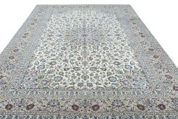 Surface texture of 2000s Kashan rug with natural Wool and intricate pattern