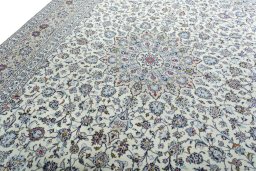 Backside of handmade 2000s Kashan rug showing knot structure and weave density