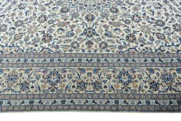 Corner detail of 2000s Kashan rug showing border pattern and Wool pile
