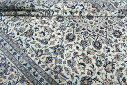 Close-up detail of 2000s Kashan rug from Iran / Persia showing Wool weave