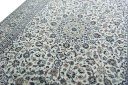 Backside of handmade 2000s Kashan rug showing knot structure and weave density