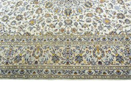 Corner detail of 2000s Kashan rug showing border pattern and Wool pile