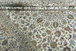 Close-up detail of 2000s Kashan rug from Iran / Persia showing Wool weave