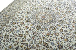 Backside of handmade 2000s Kashan rug showing knot structure and weave density